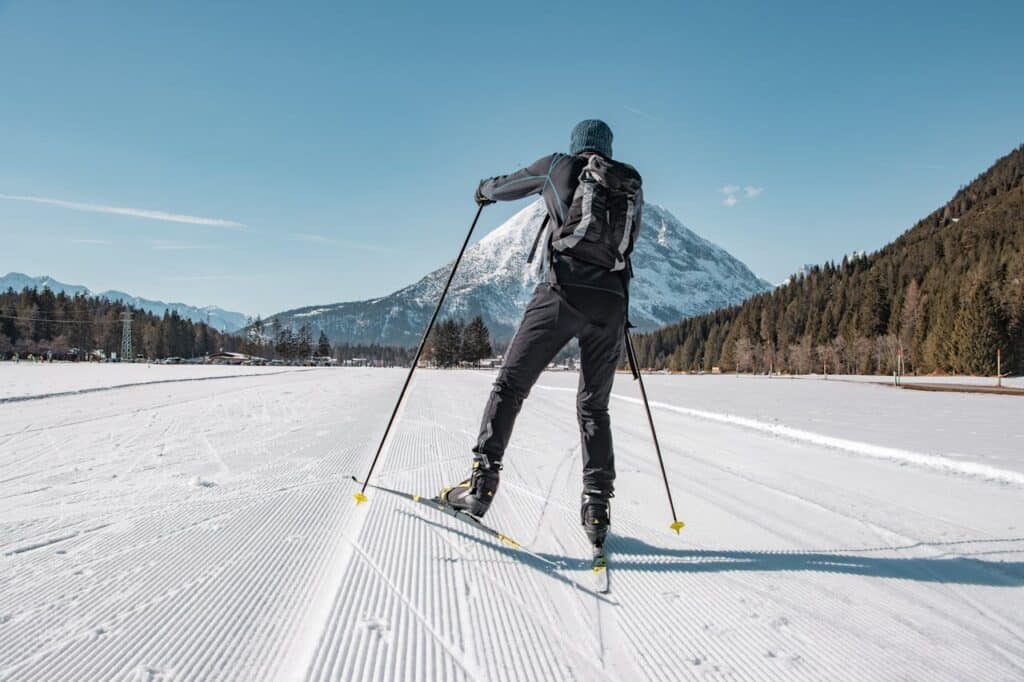 A man cross country skiing for winter vacation.