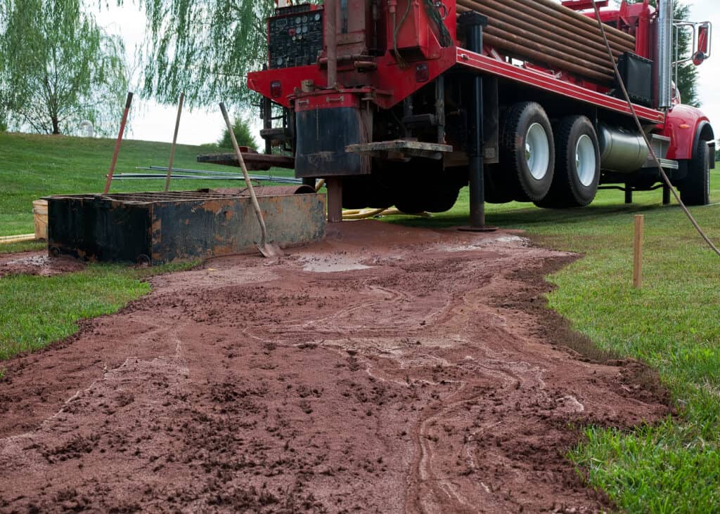 Backyard excavation for home geothermal installation.