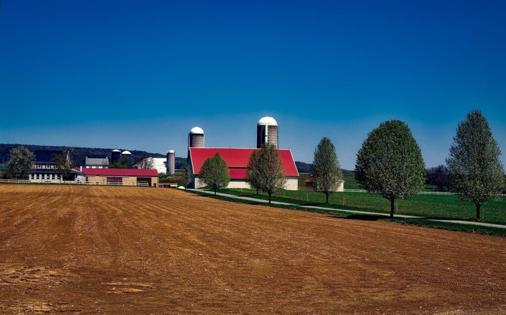Susquehanna Valley farmland, barn, two silos, and freshly manured field.