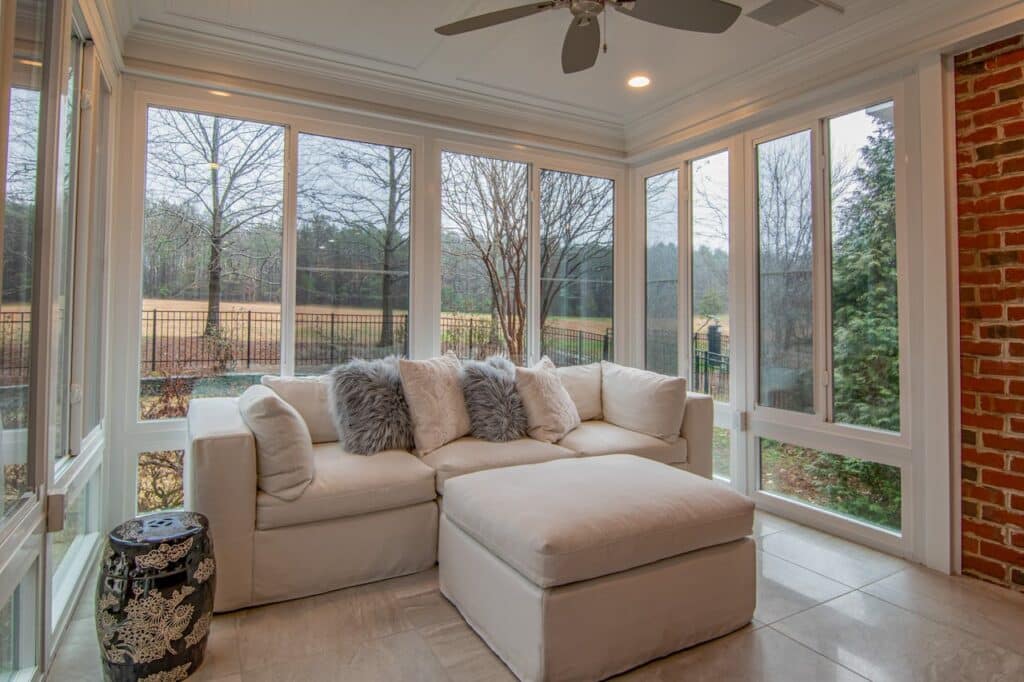Sunroom porch with sliding glass and screen windows.
