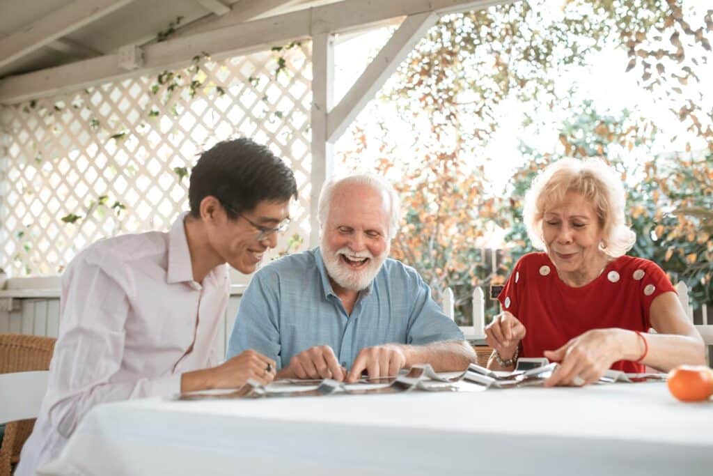Elderly couple enjoying outdoor patio.
