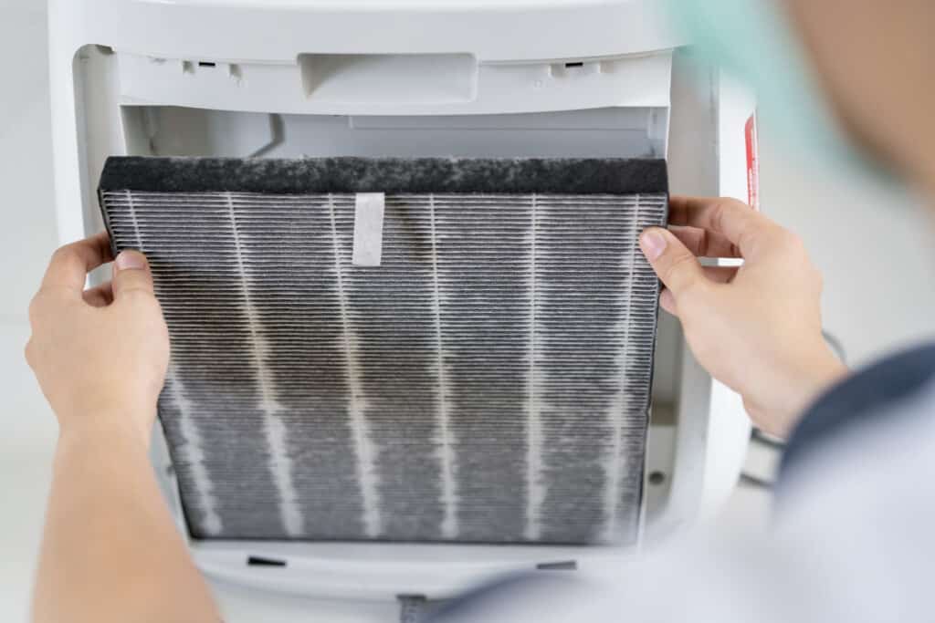 Dirty air filter being replaced by homeowner.