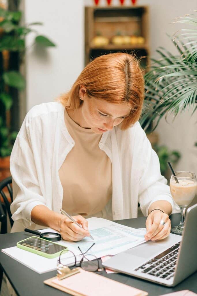 Woman evaluating AC options on her computer.