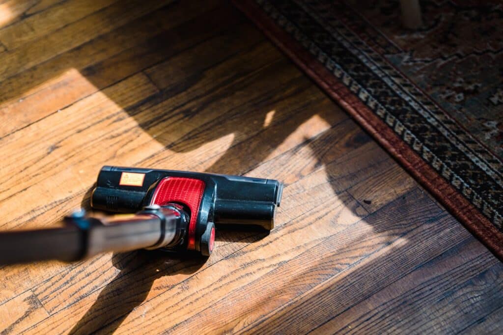 Vacuuming to reduce in home allergies.